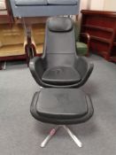 An Ikea black vinyl high backed swivel armchair with matching stool