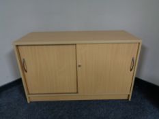 A pine effect double door office sideboard