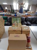 A tray of three boxed Jim Shore Heartwood Creek ornaments - Carol singer,