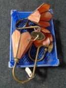 A basket of three glass wall lights