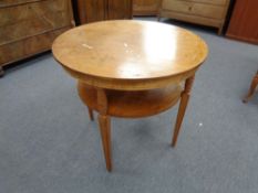 A twentieth century two tier occasional table on reeded legs