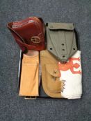 A tray of leather cartridge bag, leather holster, military shovel,
