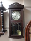 A 1930's wall clock with silvered dial,