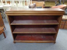 A set of twentieth century mahogany open bookshelves