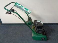 A Qualcast classic petrol 35S self propelled lawn mower