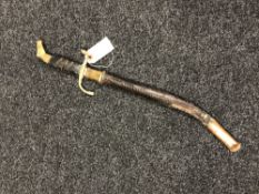 A reproduction naval dirk in sheath