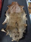 Two animal pelts of deer and boar