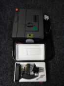 An MC Reflecta projector together with a cased microscope