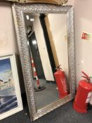 A Two-tone silvered framed mirror 4' x 2'