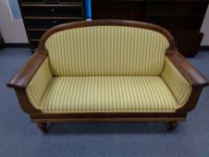 An early twentieth century settee in striped fabric
