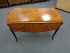 An inlaid French style coffee table with ormolu mounts