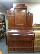 A late nineteenth century mahogany cylinder bureau bookcase
