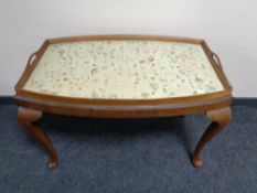 A tapestry twin handled over sized butler's tray on Queen Anne style stand