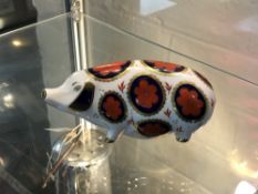 A Royal Crown Derby pig paperweight.