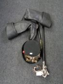 A steam punk style top hat with goggles together with boots and two walking sticks