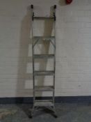 An aluminium three way ladder