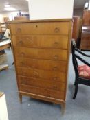 A mid century Danish teak seven drawer chest