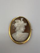 An antique gold cameo brooch