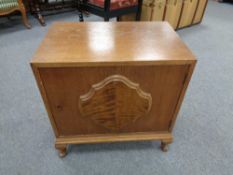 A twentieth century oak low cupboard