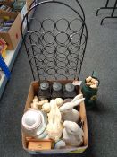 A box of rabbit ornaments, hurricane lamps, Buddha figures, Kilner drinks dispenser,