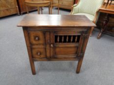 A Georgian style oak cabinet fitted two drawers