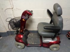 A Sterling disability mobility car with key and charger (does not charge)