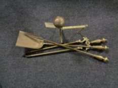 A Victorian brass fire dog with three piece companion set