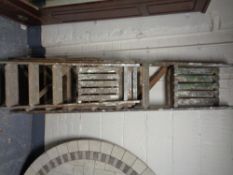 Two sets of folding wooden steps