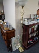 A brass effect uplighter,