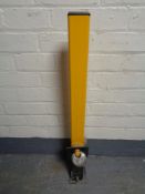 A security bollard with padlock and key