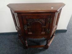An Old Charm cabinet on raised legs