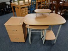 A contemporary pine effect computer desk together with two drawer filing chest
