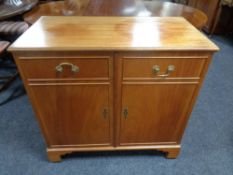 A double door TV cabinet in the form of a sideboard by R.