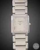 A LADIES STAINLESS STEEL & DIAMOND PATEK PHILIPPE TWENTY-4 BRACELET WATCH DATED 2006, REF. 4910/