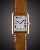 A GENTLEMAN'S SIZE 18K SOLID GOLD CARTIER TANK WRIST WATCH CIRCA 1990s Movement: Quartz, signed