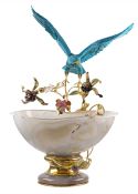 A FINE & RARE SILVER GILT & DIAMOND SET OBJET D'ART MODEL OF A FLYING FALCON ABOVE A ROCK CRYSTAL