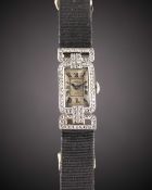 A RARE LADIES PLATINUM & DIAMOND CARTIER COCKTAIL WATCH CIRCA 1920s Movement: 19J, manual wind,