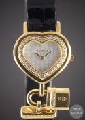 A LADIES 18K SOLID GOLD & DIAMOND CORUM HEART LOCKET WRIST WATCH CIRCA 1990s, REF. 24.181.65 WITH
