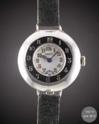 A GENTLEMAN'S SOLID SILVER ROLEX HALF HUNTER OFFICERS WRIST WATCH CIRCA 1920, WITH ENAMEL DIAL