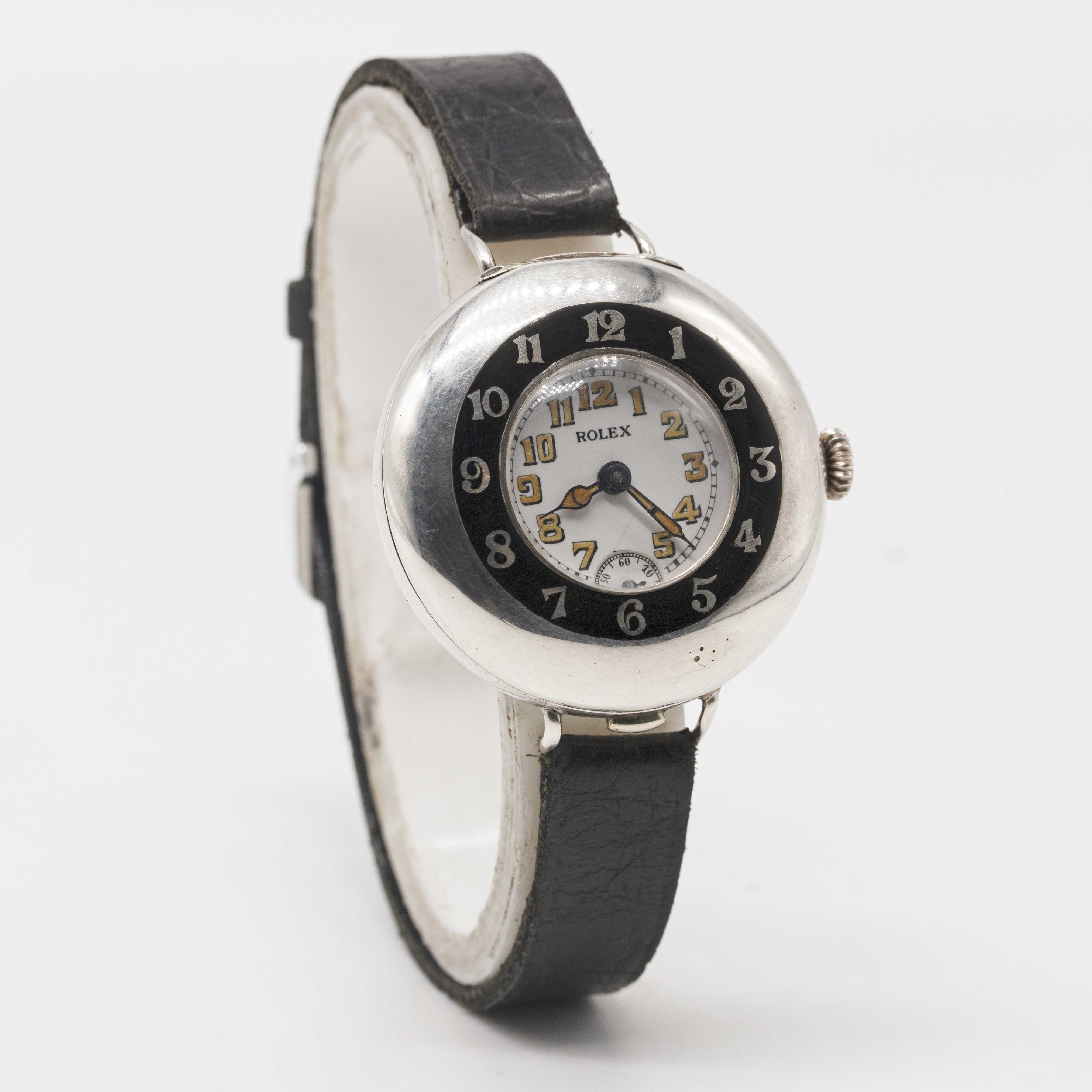 A GENTLEMAN'S SOLID SILVER ROLEX HALF HUNTER OFFICERS WRIST WATCH CIRCA 1920, WITH ENAMEL DIAL - Image 4 of 7