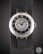 A GENTLEMAN'S SOLID SILVER ROLEX HALF HUNTER OFFICERS WRIST WATCH CIRCA 1920, WITH ENAMEL DIAL