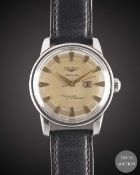 A GENTLEMAN'S STAINLESS STEEL LONGINES CONQUEST CALENDAR AUTOMATIC WRIST WATCH CIRCA 1957, REF. 9004