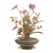 A SILVER GILT, DIAMOND & RUBY SET OBJET D'ART IN THE DESIGN OF A SPRAWLING TROPICAL PLANT CIRCA