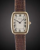 A GENTLEMAN'S SIZE 18K SOLID GOLD CARTIER FABERGE TONNEAU WRIST WATCH CIRCA 1980s Movement: 17J,