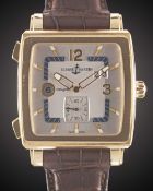 A GENTLEMAN'S 18K SOLID YELLOW GOLD ULYSSE NARDIN QUADRATO DUAL TIME WRIST WATCH CIRCA 2010, REF.