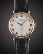 A GENTLEMAN'S 18K SOLID ROSE GOLD PATEK PHILIPPE CALATRAVA WRIST WATCH CIRCA 1990s, REF. 5022 WITH