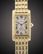 A GENTLEMAN'S SIZE 18K SOLID YELLOW GOLD CARTIER TANK AMERICAINE BRACELET WATCH CIRCA 1990s, REF.