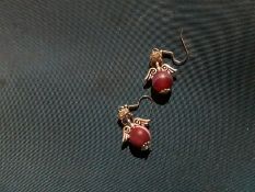 Women earrings with purple stone
