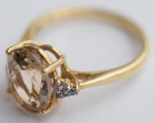 Light Pink Oval Shaped Stone Set Into 10kt Gold Band Ring