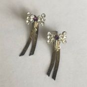 A pair of vintage silver stylised bow earrings